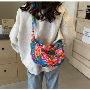 Detail of large capacity floral shoulder bag with traditional Chinese peony pattern