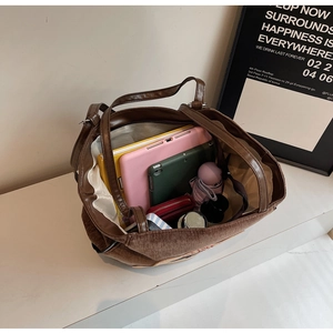 Brown corduroy large capacity tote bag with spacious interior and multiple compartments.