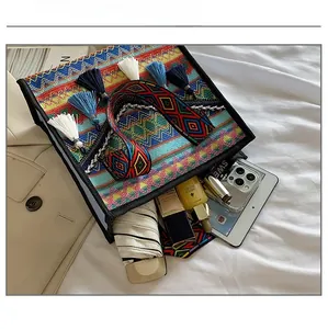Ethnic style woven tote bag showing large capacity for tablet, umbrella and cosmetics