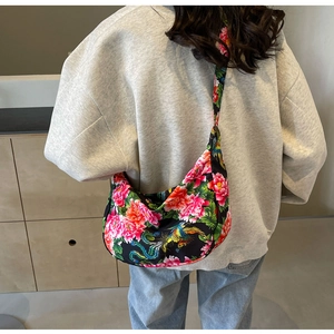 Close-up of ethnic floral crossbody bag featuring traditional Chinese peony and phoenix prints