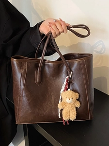 Large dark brown tote bag in vintage faux leather with a cute plush bear charm