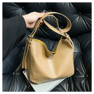 Close-up of khaki crocodile embossed texture on large capacity PU leather tote bag