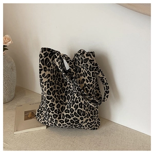 Close-up of leopard print canvas tote bag with thick shoulder straps and high capacity