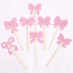 Pink glitter bow cake toppers set for girls birthday party decoration on white background