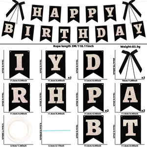 Detail of Happy Birthday banner with black swallowtail cards and gold glitter letters
