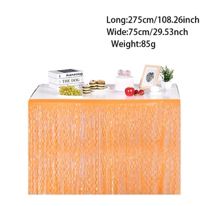 Front view of an orange wavy fringe table skirt for Halloween and party decorations