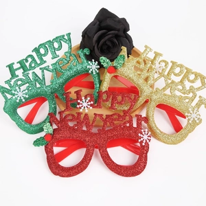 Set of three glittery Happy New Year party glasses in red, gold, and green festive colors