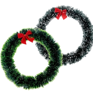 Set of two green Christmas tinsel wreaths with red bows and snow-tipped pine effect