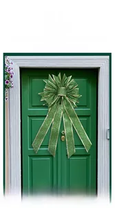 Close-up of a green St. Patrick's Day glitter bow with gold edges on a door