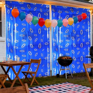 Blue foil fringe curtain with gold ring prints and colorful balloons for party decor