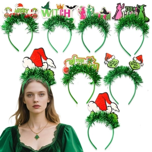 Detail of festive headbands with The Grinch theme featuring green felt and Merry Grinchmas text