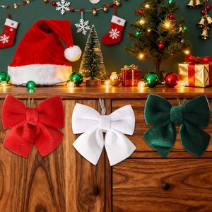 Three velvet Christmas bows in red, white and green for tree decoration
