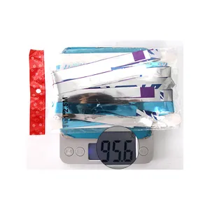 Weight measurement of 1x2.5M blue and silver snowflake foil fringe curtain on a digital scale