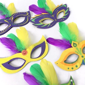 Collection of Mardi Gras feather masks in purple, green and gold for party costumes