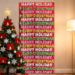 Detail of red tinsel foil curtain with printed Merry Christmas and Happy Holiday messages