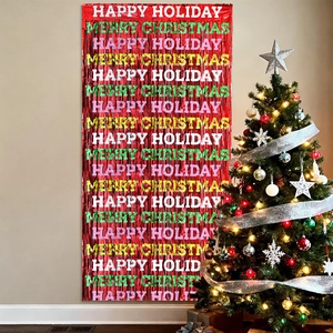 Detail of red foil fringe curtain with festive Happy Holiday and Merry Christmas printing