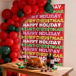 Close-up of red foil fringe curtain with festive Merry Christmas printing and balloon arch