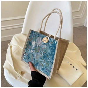 Detail of floral brocade linen lunch bag with large wooden button and rope handle