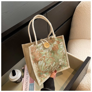 Detail of linen tote bag with floral oil painting pattern and cotton rope handle