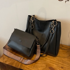 Black two-piece tote bag set with metal chain handle and vintage geometric strap