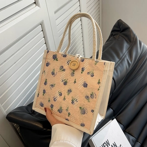 Pink floral lace lunch bag with sturdy cotton rope handles and a decorative wooden button