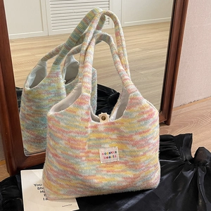 Rainbow striped woven tote bag with soft furry texture and metal snap button closure