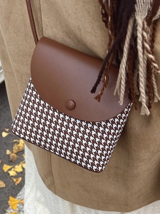Retro houndstooth bucket bag with brown flap lid and thin shoulder strap for autumn