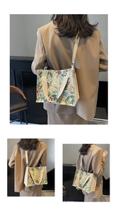 Detail of floral tapestry tote bag featuring vintage flower patterns and shoulder straps