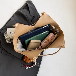 Large capacity plaid tote bag showing open compartment with umbrella and essentials