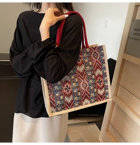 Detailed close-up of geometric jacquard weave texture on large capacity linen tote bag
