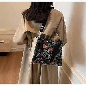 Detail of floral tapestry tote showing vintage woven fabric and beige canvas side panels