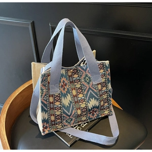 Macro detail of ethnic jacquard pattern and premium canvas texture on tote bag