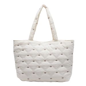 Beige quilted tote bag with brown bow embroidery for daily commuting and leisure use