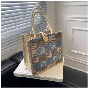 Detail of checkered linen tote bag with rustic wooden button and soft cotton rope handle