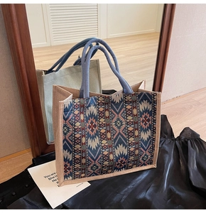 Detail of geometric pattern linen tote with blue braided rope handle for women