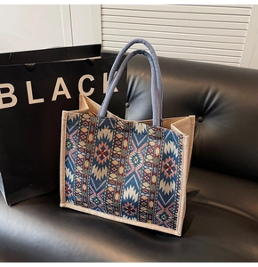 Detail of handwoven geometric pattern and jute texture on a large linen tote bag