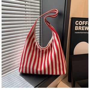 Detailed close-up of red and white striped tote bag showing durable knitted texture