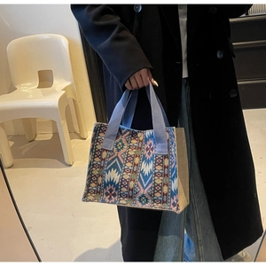 Ethnic woven tote bag with colorful geometric patterns and magnetic buckle closure