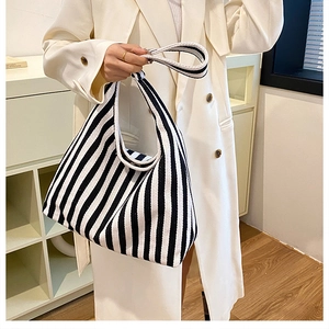 Detailed view of high-density canvas hobo tote with classic black and white stripes