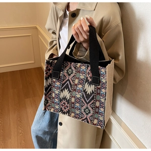 Ethnic style woven tote bag featuring geometric jacquard patterns and cotton linen texture