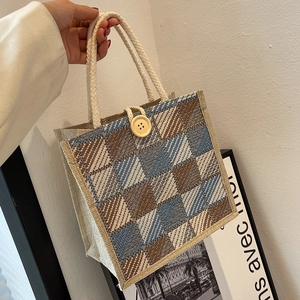 Linen checkered tote bag with woven rope handles and wooden button closure