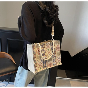 Ethnic geometric woven tote bag featuring colorful patterns and adjustable cotton straps