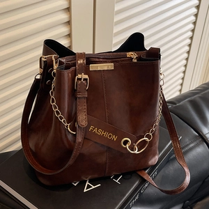 Retro dark brown bucket bag with gold chain and glossy faux leather for autumn fashion