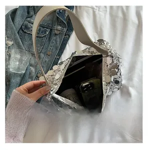 Detailed interior of silver sequin tote bag showing storage capacity for daily essentials