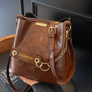 Retro dark brown leather bucket bag with gold chain strap and fashion letter detail