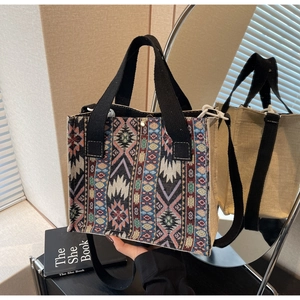 Detailed ethnic geometric woven tote bag featuring soft canvas texture and woven straps
