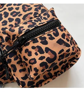 Macro shot of leopard print fabric detail with high-quality zipper and woven texture