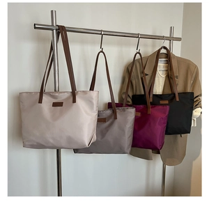 Large capacity nylon tote bags in beige, grey, burgundy, and black with leather straps