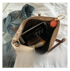 Detail view of large tote bag interior showing ample storage space for books and daily items