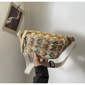 Close-up of geometric jacquard fabric and adjustable strap on ethnic style waist bag